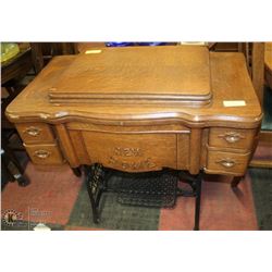ANTIQUE NEW HOME SEWING MACHINE WITH CABINET