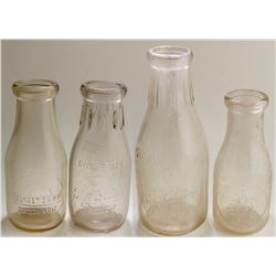 Four Tucson Embossed Milk Bottles