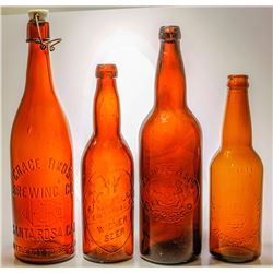 Four Brown Beer Bottles