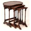 Image 1 : Kidney shaped walnut nest of three tables o…