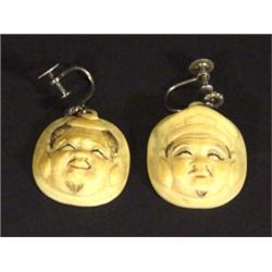 Two Japanese ivory earrings carved with fac…