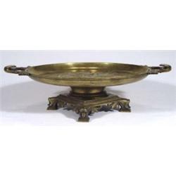 Circular brass tazza, cast with a young nud…