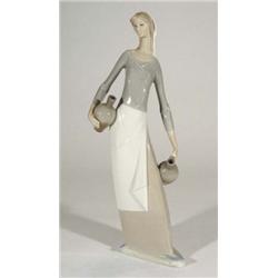 Large hand painted Nao figurine clutching w…