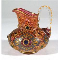 Cranberry style jewelled glass milk jug, 12…