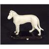 Image 1 : Carved ivory dog on an ebonised base, 7cm h…