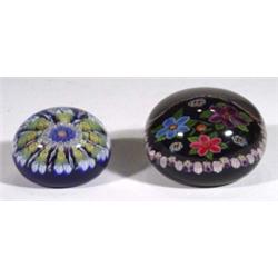 Two glass paperweights with floral coloured…