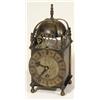 Image 1 : Brass lantern clock with dolphin decoration…