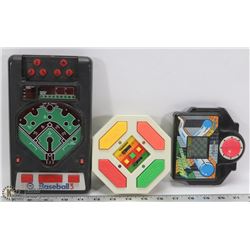 THREE ASSORTED VINTAGE HAND HELD ELECTRONIC GAMES