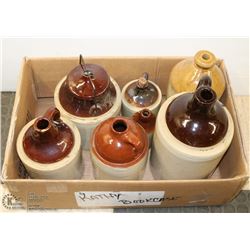 LARGE FLAT WITH 6 VINTAGE WINE JUGS AND CROCK WITH