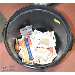 SMALL GARBAGE BIN FILLED WITH ASSORTED DOG BONES