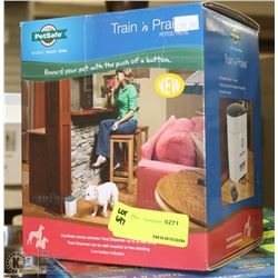 PETSAFE TRAIN AND PRAISE TREAT DISPENSER. PETS