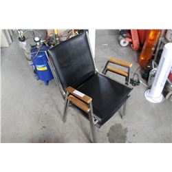 TWO BLACK AND METAL STACKING CHAIRS