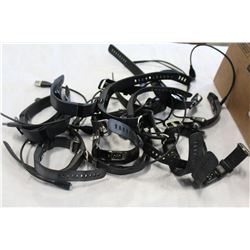 BOX OF FIT BITS AND EARBUDS