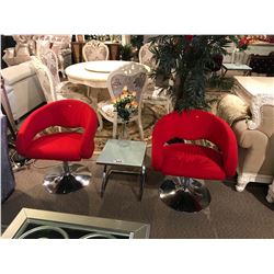 2 RED MODERN SWIVEL CHAIRS WITH END TABLE & FLORAL DECOR