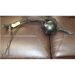 AFRICAN POTTERY JUG ON VINE WITH HANGING ROPE