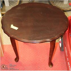 VINTAGE OVAL WOOD TABLE (24"L X 22"W X 21"H) -