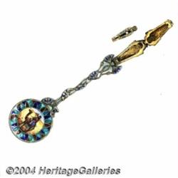 A SILVER AND PLIQUE-A-JOUR ENAMEL MUMMY SOUVENIR SPOON