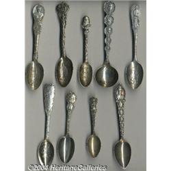 A GROUP OF NINE SILVER PERSONALITY SOUVENIR SPOONS