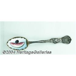 A SILVER AND ENAMEL BLACK AMERICANA SOUVENIR SPOON