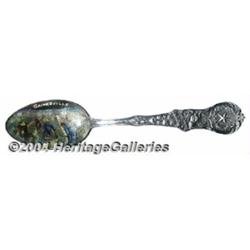 A SILVER AND ENAMEL BLACK AMERICANA SOUVENIR SPOON