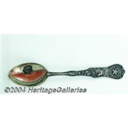 A SILVER AND ENAMEL BLACK AMERICANA SOUVENIR SPOON