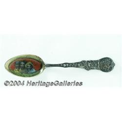 A SILVER AND ENAMEL BLACK AMERICANA SOUVENIR SPOON