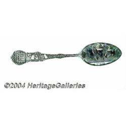 A SILVER AND ENAMEL BLACK AMERICANA SOUVENIR SPOON