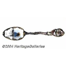 A SILVER AND ENAMEL BLACK AMERICANA SOUVENIR SPOON