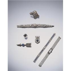 AN UNUSUAL MULTI-COLORED DIAMOND AND A NEAR-COLORLESS DIAMOND FLOWER BASKET BROOCH