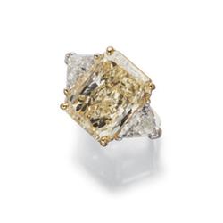 A FANCY YELLOW DIAMOND AND DIAMOND RING