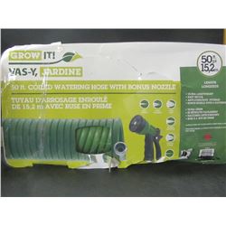New 50 foot coiled watering hose with Nozzele