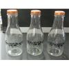 Image 1 : 3 Glass Milk Bottles with lids  from D ' Dutchman Dairy in Sicamous BC