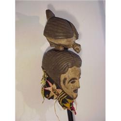 Tribal Art, HEADDRESS WITH MAN AND BIRD, a carved and painted wood with fabric dressing, 23 x 9...