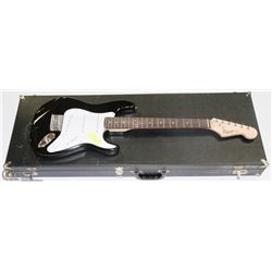 SQUIRE BY FENDER BLACK MINI GUITAR WITH HARD CASE.