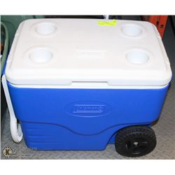 BLUE & WHITE COLEMAN COOLER ON WHEELS