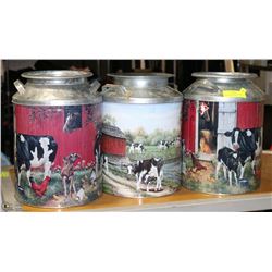 LOT OF 3 VINTAGE STYLE MILK TINS WITH COWS ON THEM