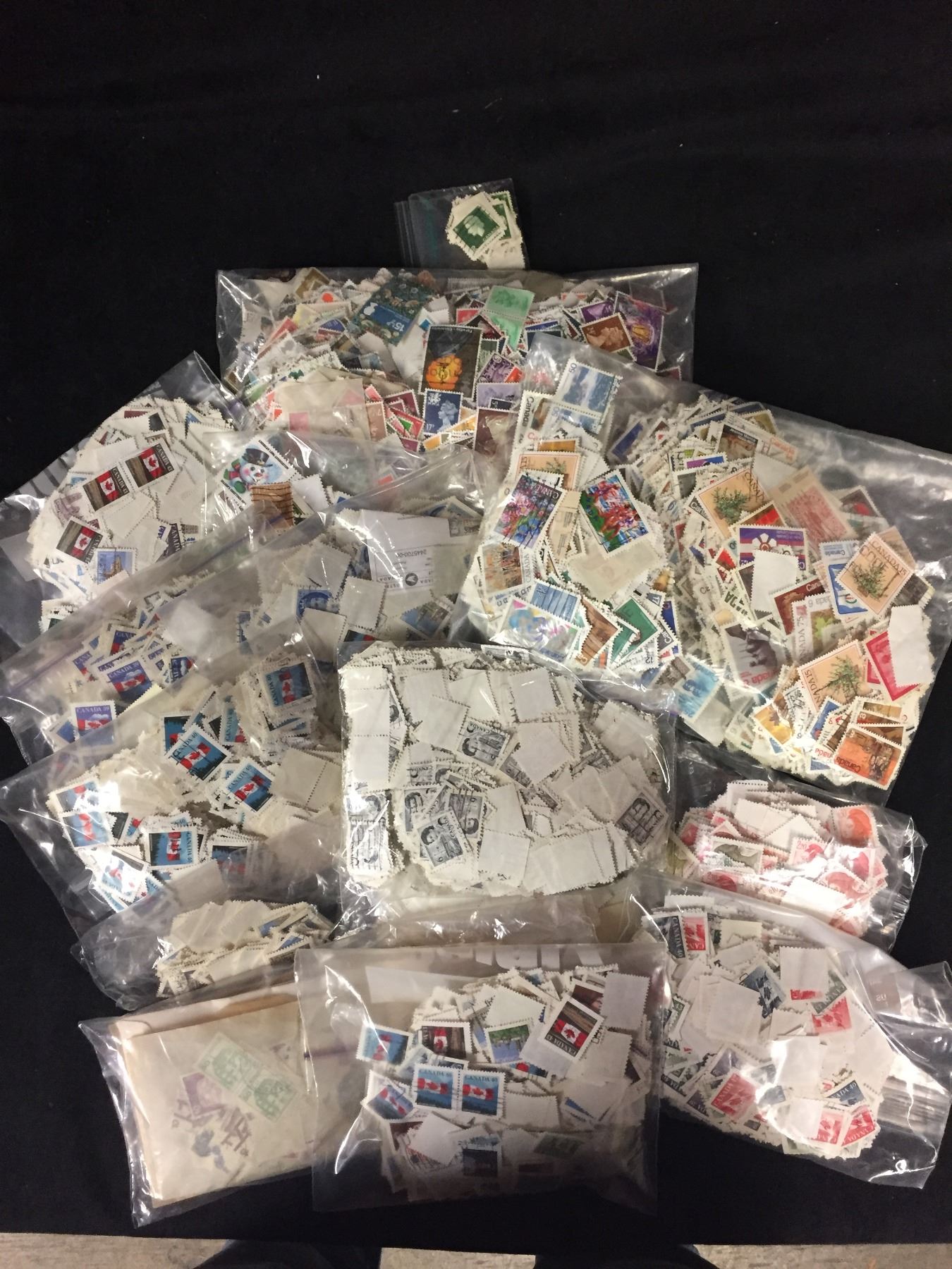 APPROX 10,000 VARIOUS STAMPS LOT