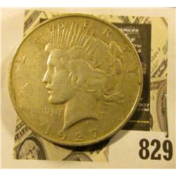 1927 D U.S. Silver Peace Dollar.