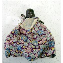 3 1/2" Black Baby Doll with original calico dress from the 1950's. Made in Japan