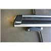 Image 2 : PAIR OF THULE 36 INCH SKI/BOARD ROOF RACKS WITH UNIVERSAL MOUNTS AND KEY