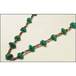 Silver and turquoise necklace, formed of 15 turquoise nuggets separated by fluted and ovoid sil...