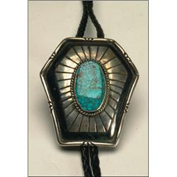 Navajo silver and leather bolo tie, set with an oval turquoise slab encircled with twisted wire...
