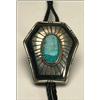 Image 1 : Navajo silver and leather bolo tie, set with an oval turquoise slab encircled with twisted wire...