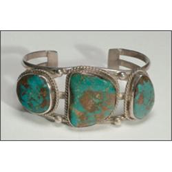 Navajo silver open bangle, formed of three bands overlain with irregular turquoise slabs framed...