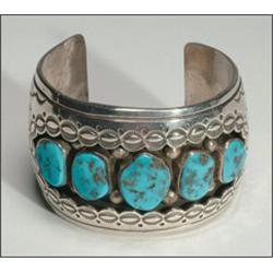Navajo sterling silver open bangle, formed as a thick cuff and set with 5 irregular turquoise c...