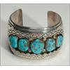 Image 1 : Navajo sterling silver open bangle, formed as a thick cuff and set with 5 irregular turquoise c...
