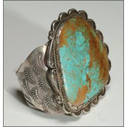 Navajo sterling silver open bangle, formed of 8 wrought bands set with a large irregular turquo...