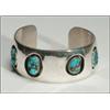 Image 1 : Navajo sterling silver open bangle, set with 4 irregular turquoise nuggets in shadow-boxed serr...