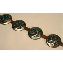 Navajo sterling silver and leather belt, formed of a buckle and 8 circular conchas each set wit...