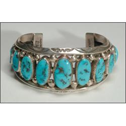 Navajo sterling silver open bangle, formed of one oval and two carinated ingot bands surmounted...